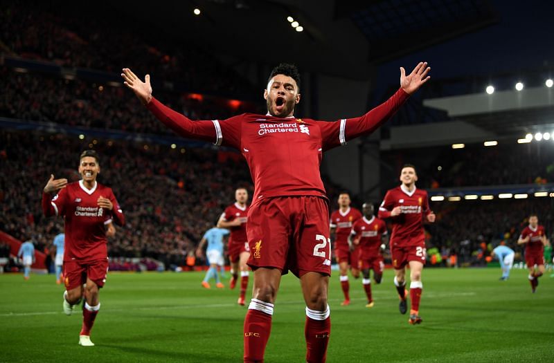 Alex Oxlade Chamberlain celebrates for Liverpool against Manchester City.