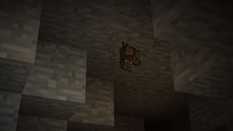Bats can spawn and hang upside down on blocks, similar to live bats. (Image via Minecraft)