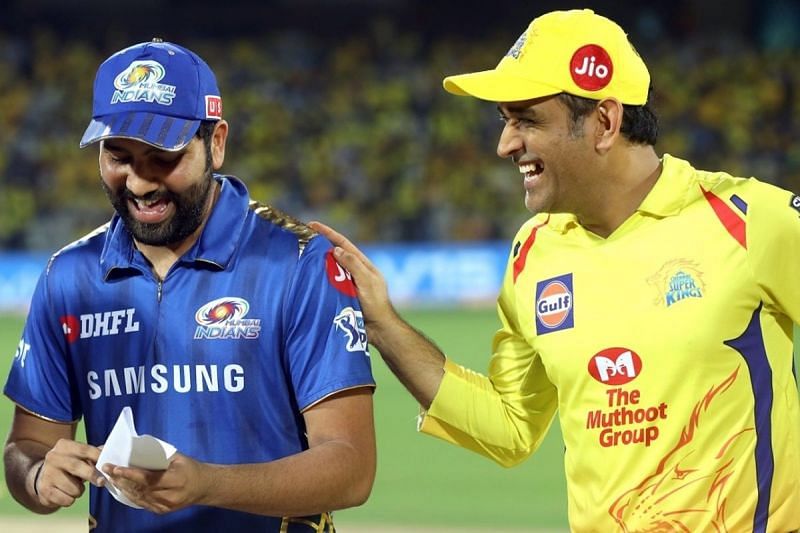 Rohit Sharma (L) and MS Dhoni share a laugh ahead of an IPL game between MI and CSK