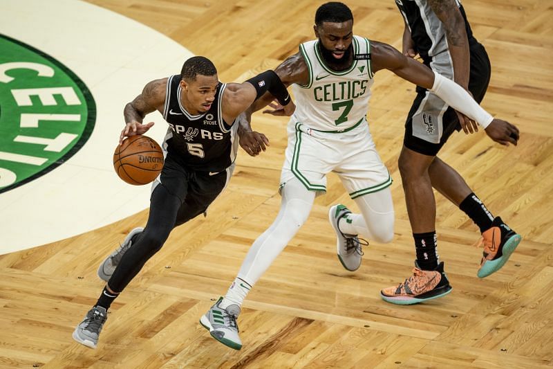 San Antonio Spurs point gaurd #5 Dejounte Murray uses a screen