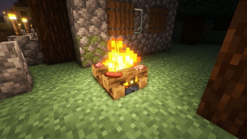 Food cooking on a campfire (Image via Minecraft)