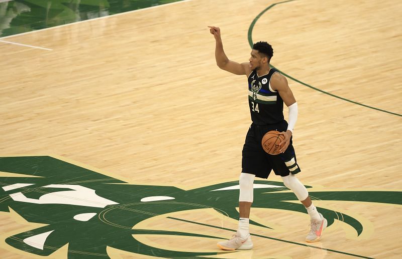 Giannis Antetokounmpo #34 of the Milwaukee Bucks brings the ball up court against the Phoenix Suns during the second half in Game Six of the NBA Finals at Fiserv Forum on July 20, 2021 in Milwaukee, Wisconsin.