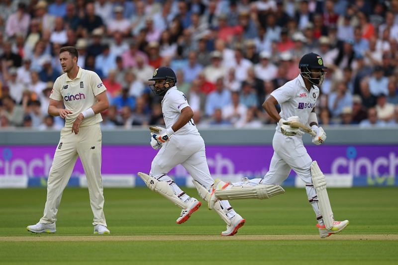 Rohit Sharma (L) and KL Rahul of India run a single as Ollie Robinson of England looks on Day 2 of The Oval Test. Pic: Getty Images