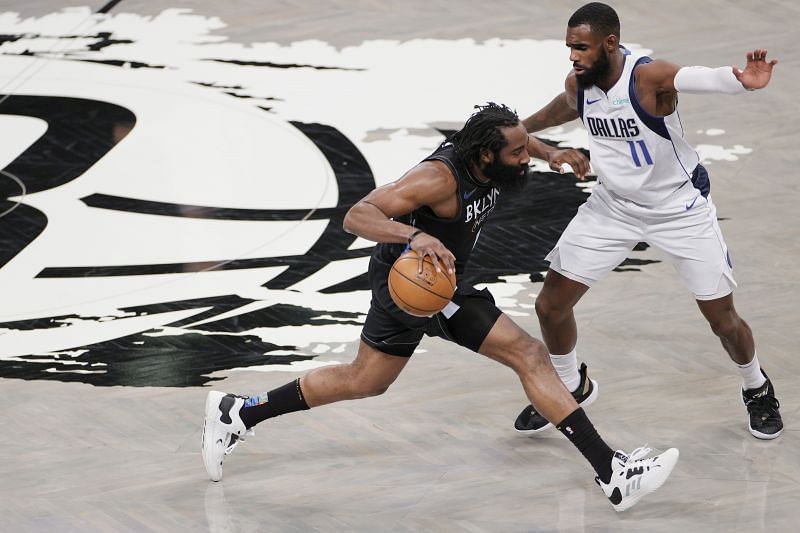 James Harden #13 of the Brooklyn Nets dribbles as Tim Hardaway Jr. #11 of the Dallas Mavericks defends during the second half at Barclays Center on February 27, 2021 in the Brooklyn borough of New York City. The Mavericks won 115-98.