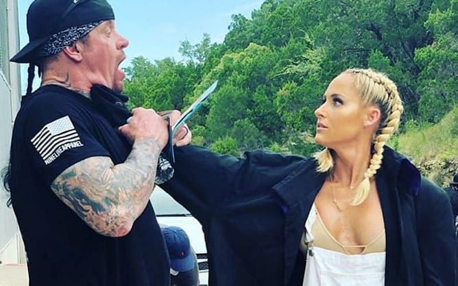 What is the age difference between The Undertaker and his wife Michelle McCool?
