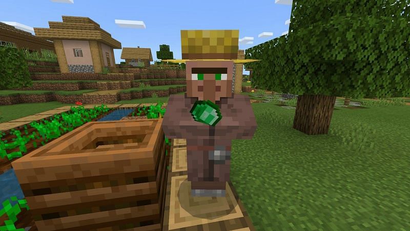 A farmer villager holding an emerald during a trade (Image via Minecraft)