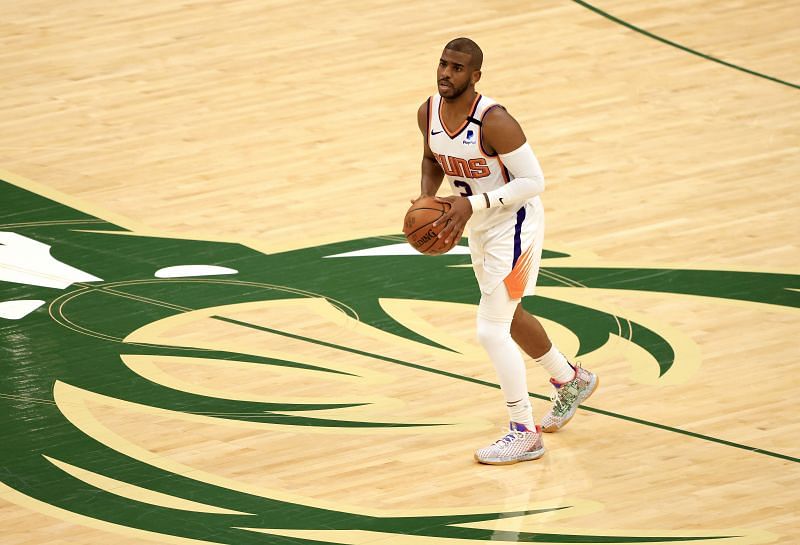 Chris Paul #3 of the Phoenix Suns brings the ball up the court during the first half in Game Three of the NBA Finals against the Milwaukee Bucks at Fiserv Forum on July 11, 2021 in Milwaukee, Wisconsin.