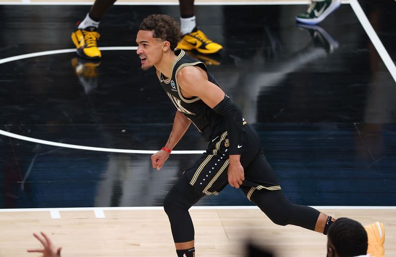 Trae Young #11 of the Atlanta Hawks react after a basket against the Milwaukee Bucks during the second half in Game Six of the Eastern Conference Finals at State Farm Arena on July 03, 2021 in Atlanta, Georgia.