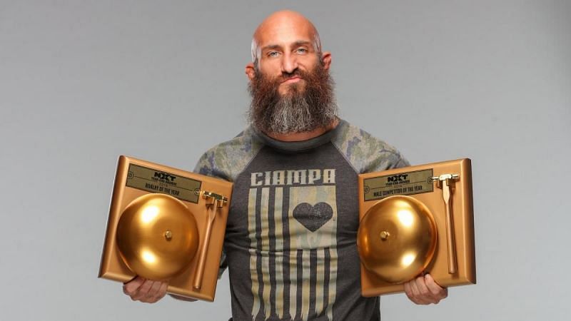 Tommaso Ciampa posing with his NXT end-of-year awards