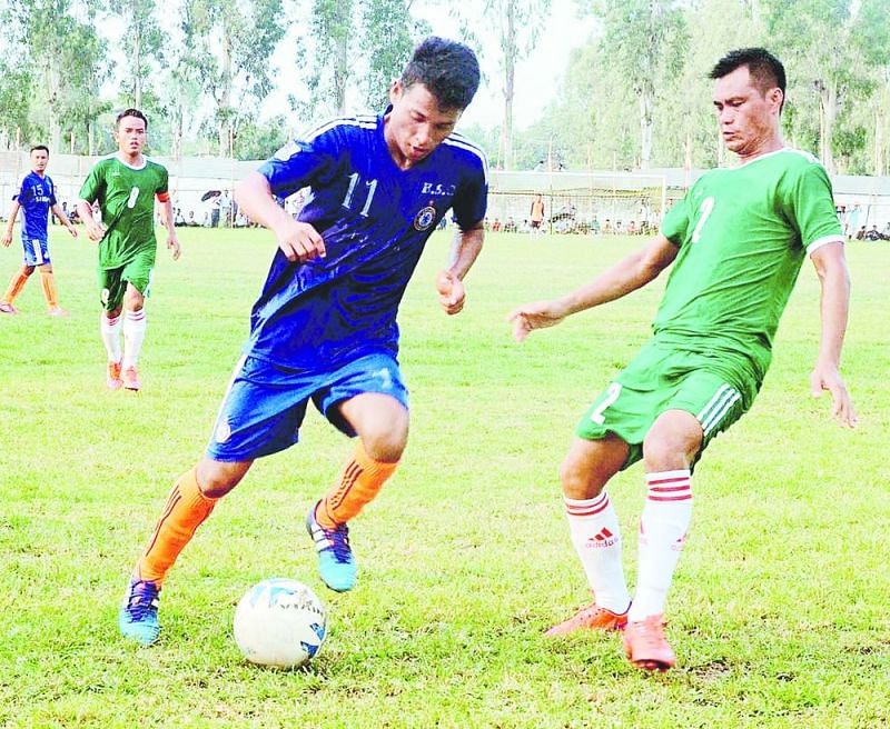 Assam Rifles (in green) and Borbheta players in action in Tezpur. (Image: UB Photos)