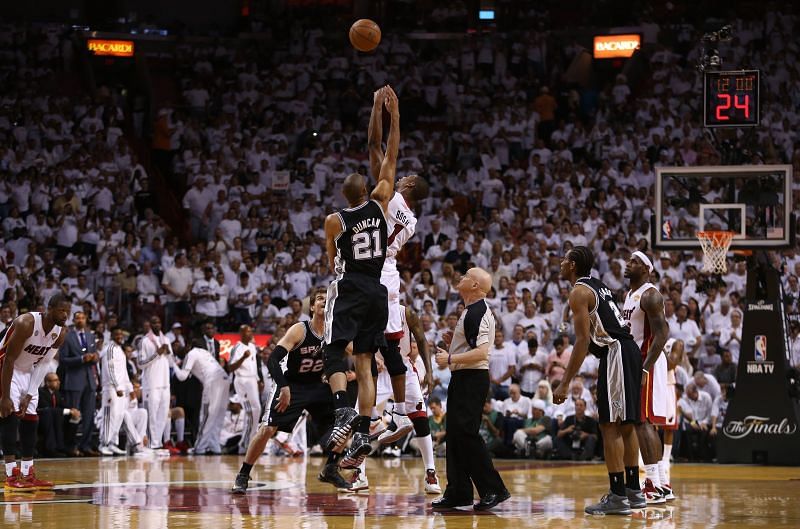 Chris Bosh jumps for the tip-off against the San Antonio Spurs
