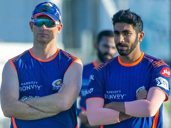 Mumbai Indians bowling coach Shane Bond (L) and Jasprit Bumrah