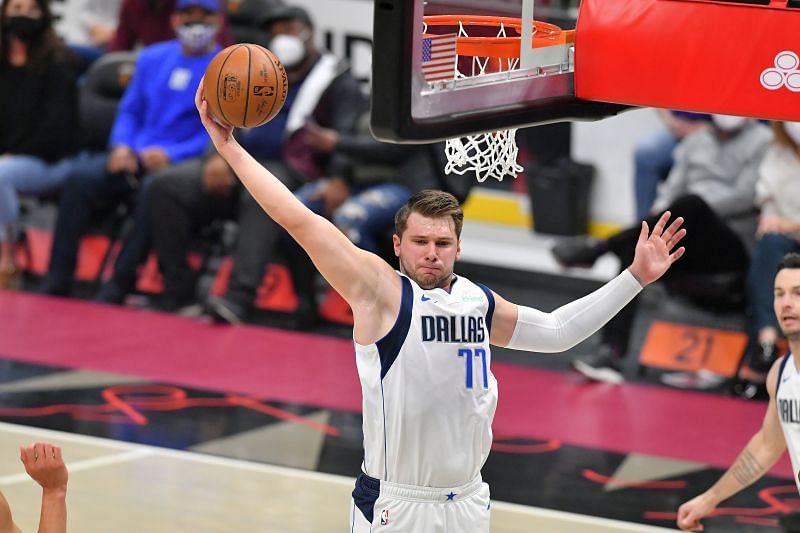 Luka Doncic #77 of the Dallas Mavericks grabs a rebound.