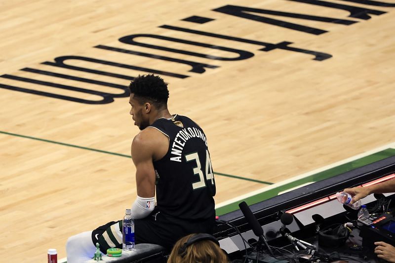Giannis Antetokounmpo takes a breather during Game 6 of the 2021 NBA Finals.