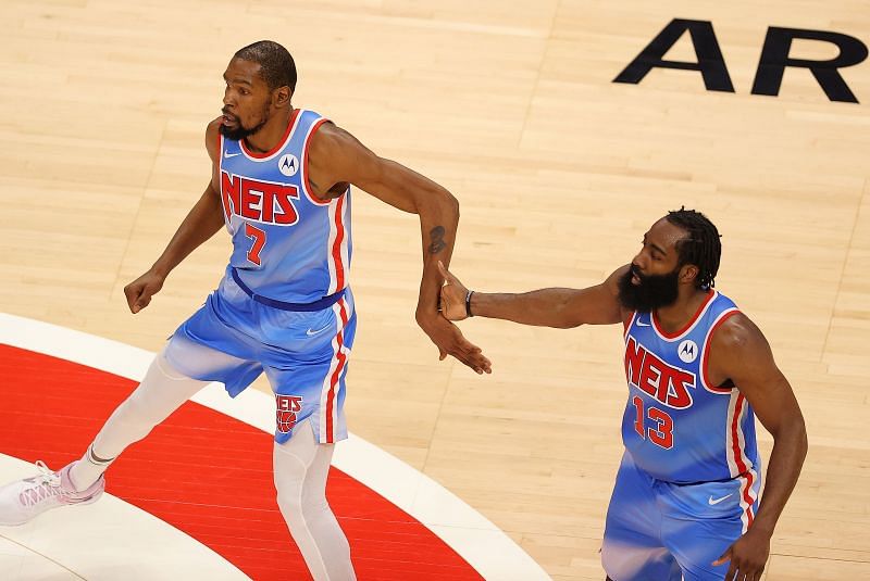 Kevin Durant and James Harden in action during an NBA game.