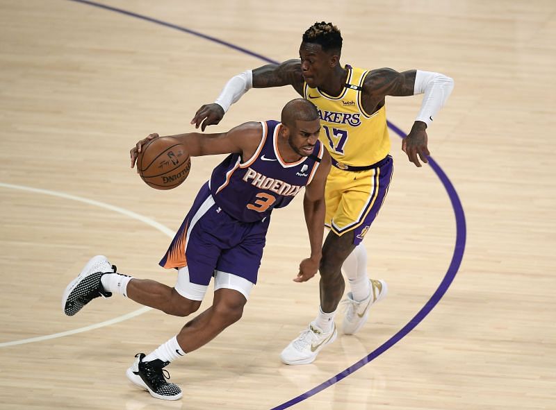 Chris Paul #3 of the Phoenix Suns dribbles as Dennis Schroder #17 of the Los Angeles Lakers reaches for the ball in the third quarter during game six of the Western Conference first round series at Staples Center on June 03, 2021 in Los Angeles, California.