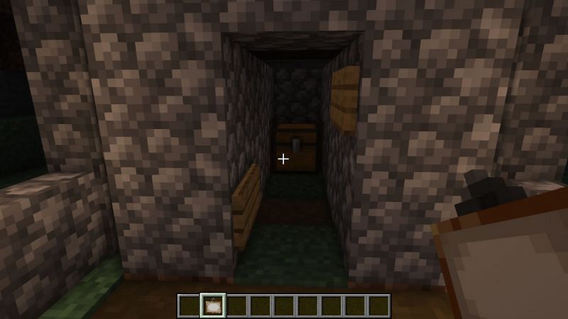 Paintings need to be placed on top of the signs to hide the entrance (Image via Minecraft)