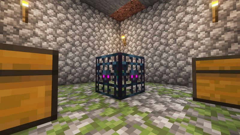 A zombie spawner and two chests in a dungeon (Image via Minecraft)