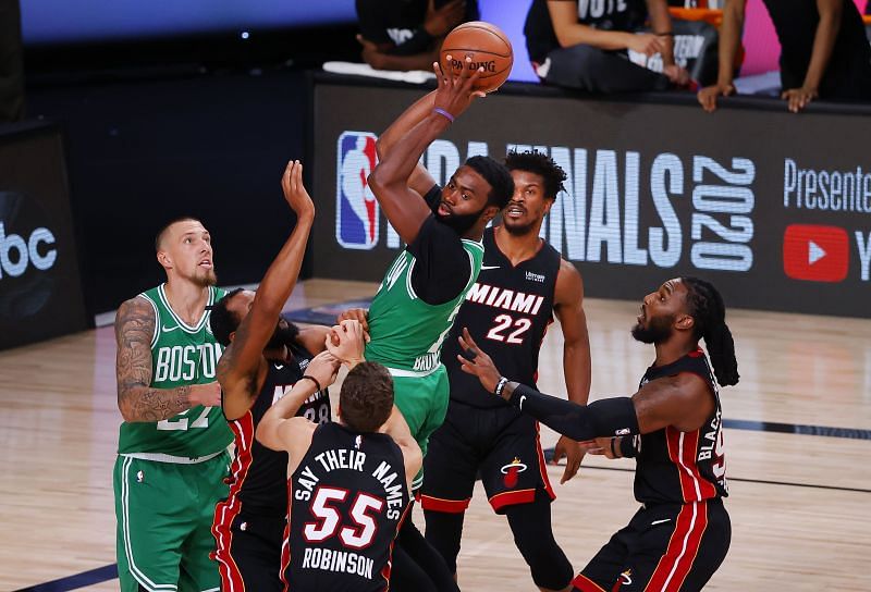 Jaylen Brown looks to pass out of tight Miami Heat defense.