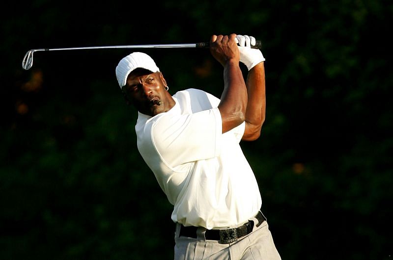 Michael Jordan watches a shot from the rough