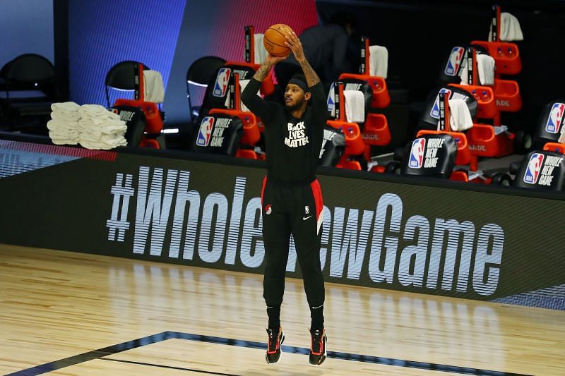 Carmelo Anthony gets his shots ahead of a game.