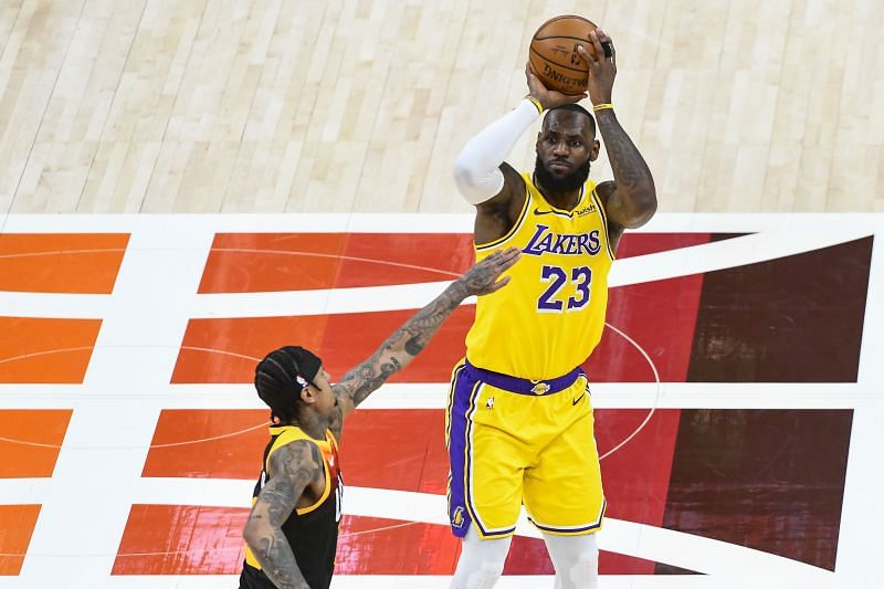 LeBron James #23 of the Los Angeles Lakers shoots over Jordan Clarkson #00
