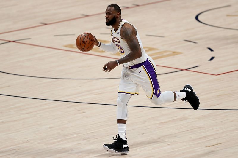 LeBron James brings the ball up court against the Denver Nuggets