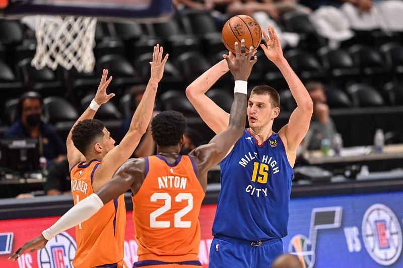 Nikola Jokic #15 of the Denver Nuggets looks for a shot against the Phoenix Suns in Game Three of the Western Conference second-round playoff series at Ball Arena on June 11, 2021 in Denver, Colorado.