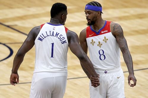 Zion Williamson #1 of the New Orleans Pelicans and Naji Marshall #8 of the New Orleans Pelicans reacts after a score during the fourth quarter of an NBA game against the Golden State Warriors at Smoothie King Center on May 04, 2021 in New Orleans, Louisiana. New Orleans Pelicans won the game 108 - 103.