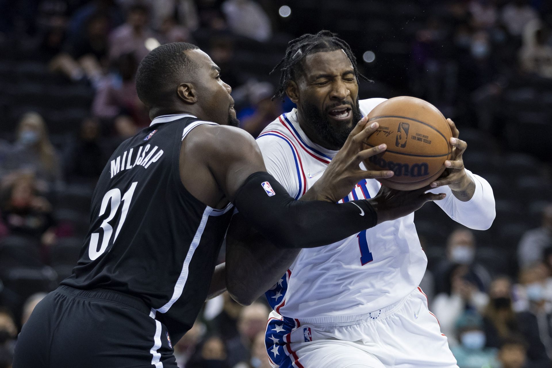 Andre Drummond #1 of the Philadelphia 76ers drives to the basket against Paul Millsap #31 of the Brooklyn Nets