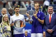 Novak Djokovic and <a href='https://www.sportskeeda.com/player/daniil-medvedev' target='_blank' rel='noopener noreferrer'>Daniil Medvedev</a> with their respective trophies at the 2021 US Open