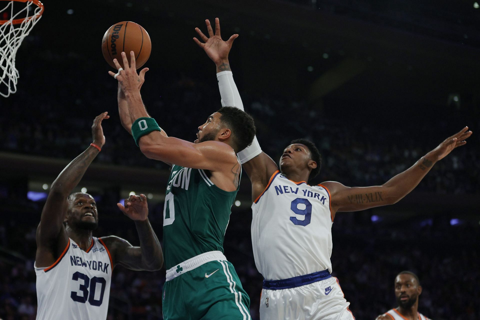 The Boston Celtics and the New York Knicks put on a show in their season opener at a raucous Madison Square Garden.