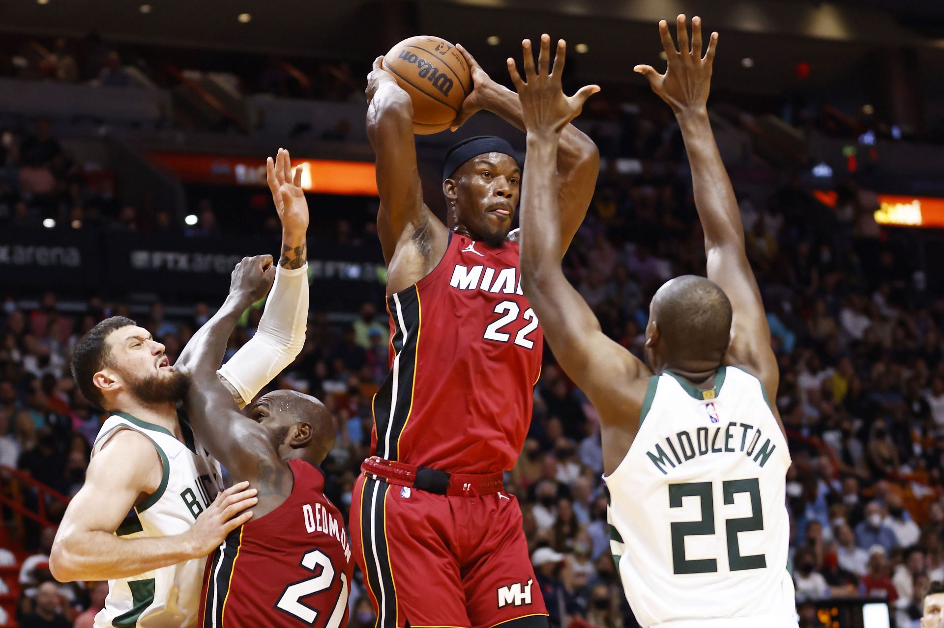 Jimmy Butler (#22) of the Miami Heat throws a pass against the Milwaukee Bucks.