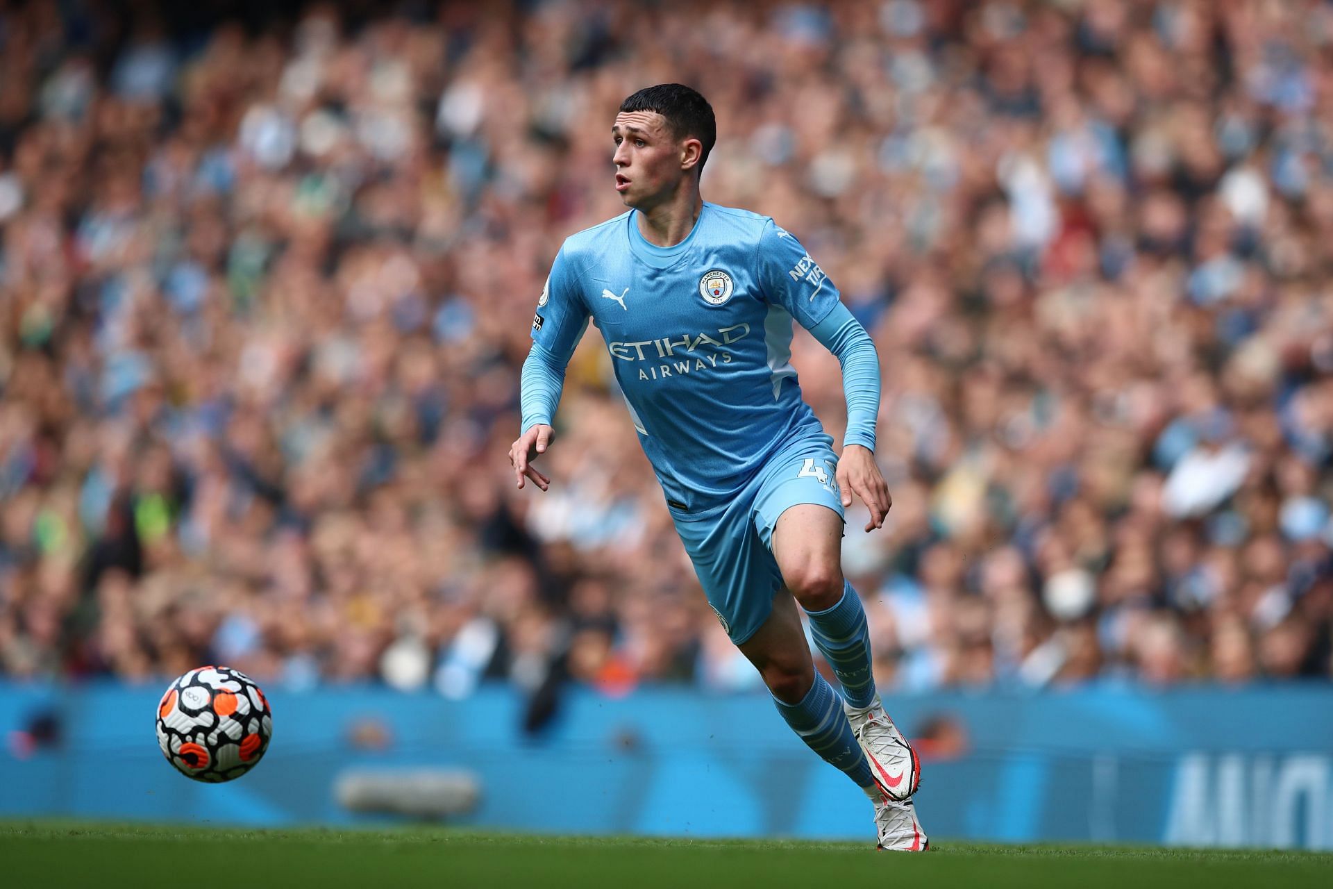 Phil Foden in action for Manchester City against Burnley.