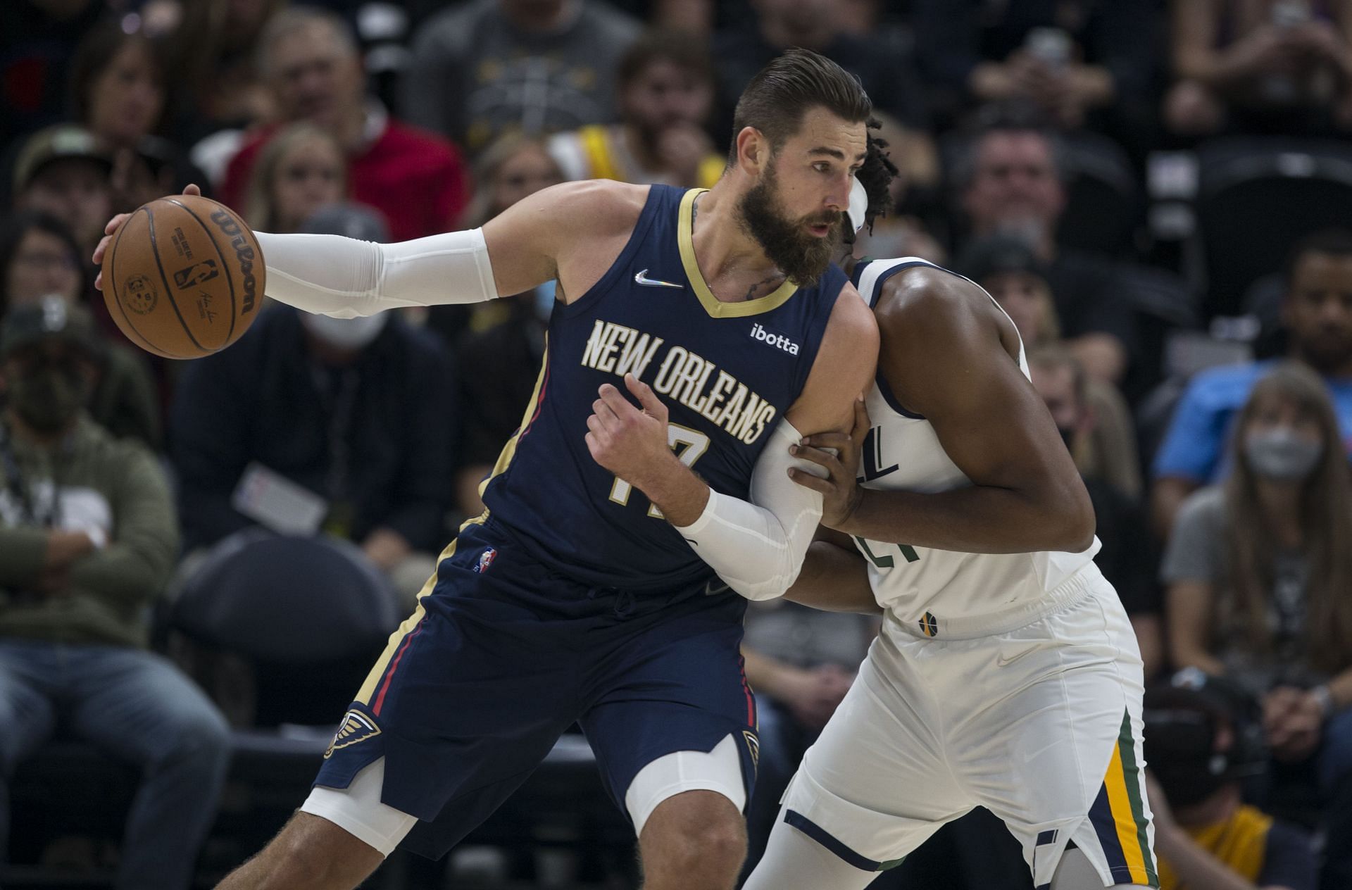 Jonas Valanciunas #17 of the New Orleans Pelicans backs down Hassan Whiteside #21 of the Utah Jazz as he works his way to the basket during the first half of their game on October 11, 2021 at the Vivint Smart Home Arena in Salt Lake City, Utah.