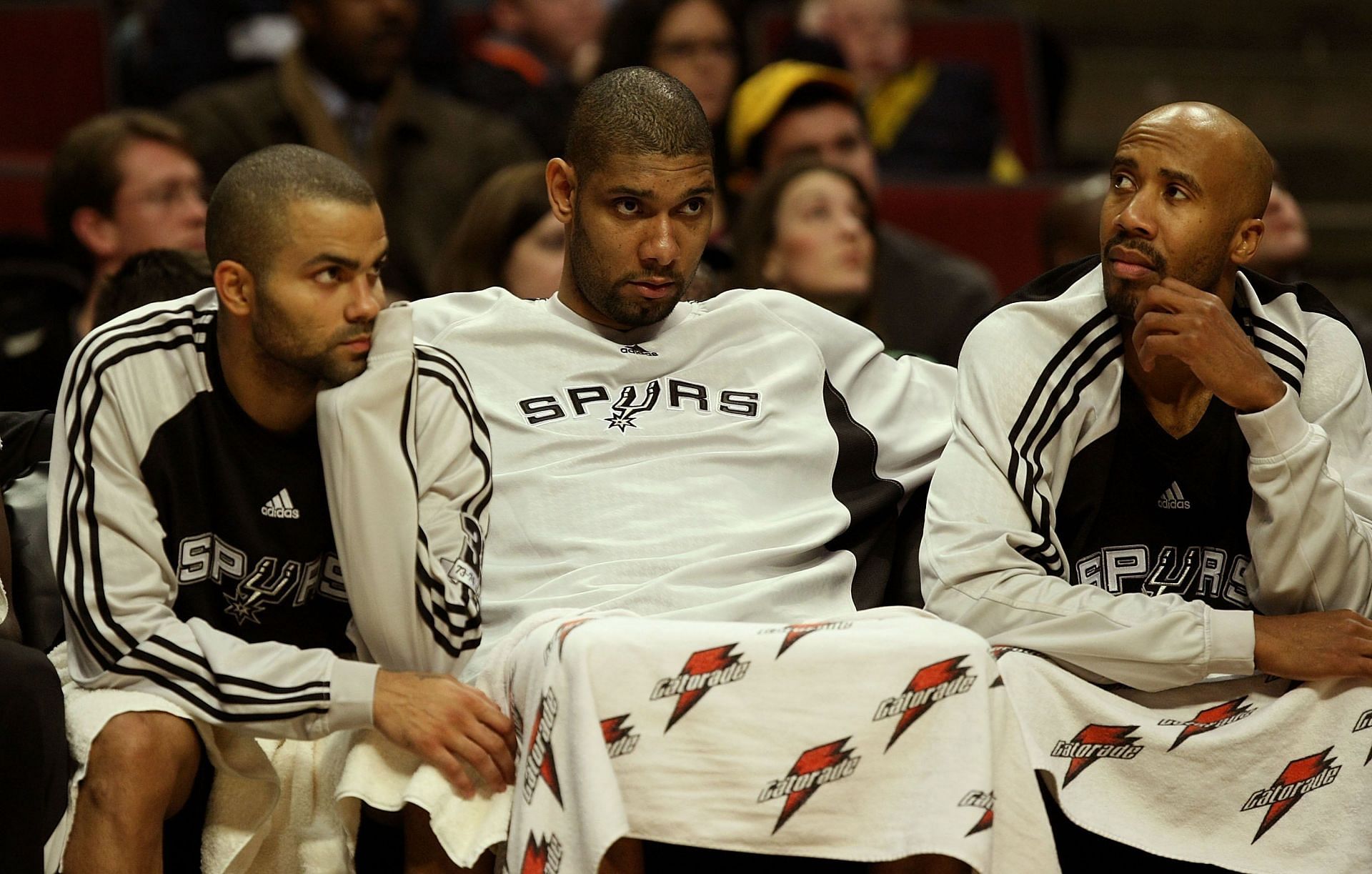 Tony Parker #7, Tim Duncan #21 and Bruce Bowen #12 of the San Antonio Spurs