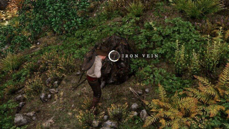 A player mining an iron vein. (Image via Amazon Games)