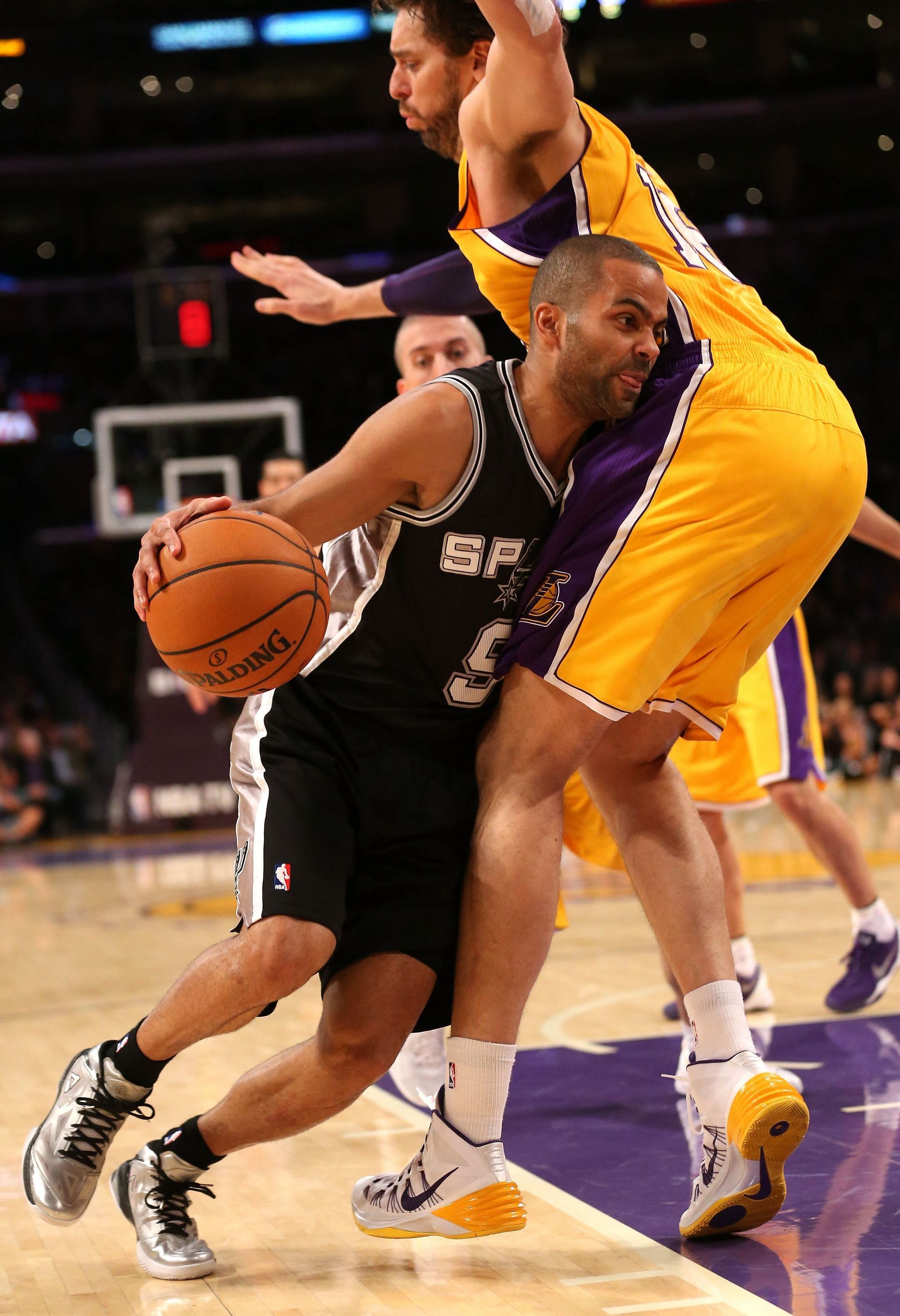 Tony Parker #9 of the San Antonio Spurs drives against Pau Gasol #16 of the Los Angeles Lakers at Staples Center on November 1, 2013 in Los Angeles, California.