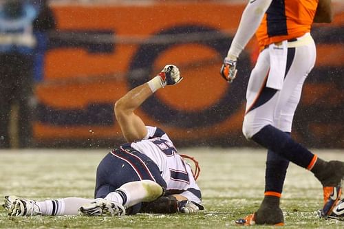 Rob Gronkowski of the New England Patriots lies injured v the Denver Broncos