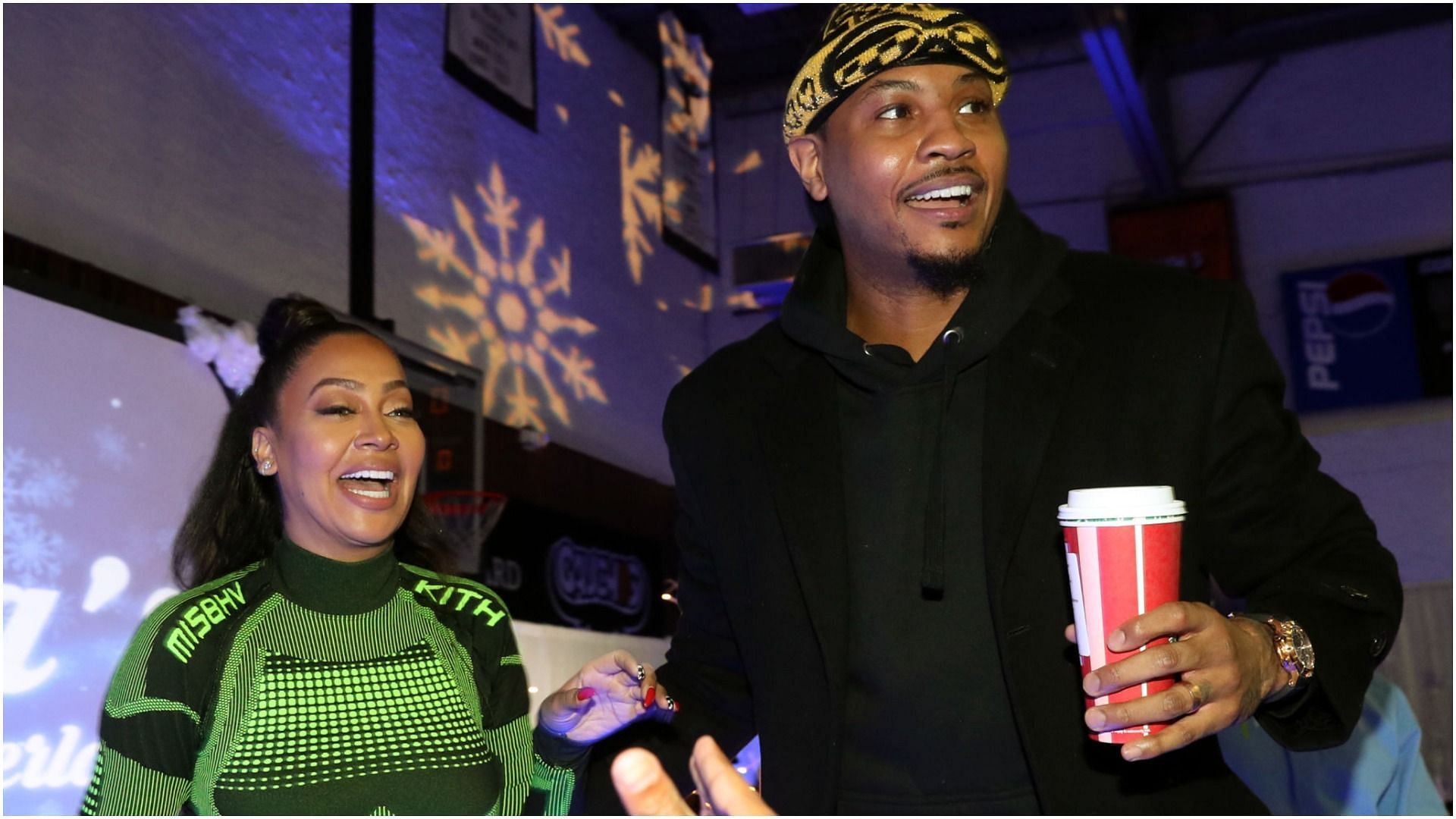La La Anthony and Carmelo Anthony attend the 3rd Annual Winter Wonderland Holiday Charity Event (Image via Getty Images)