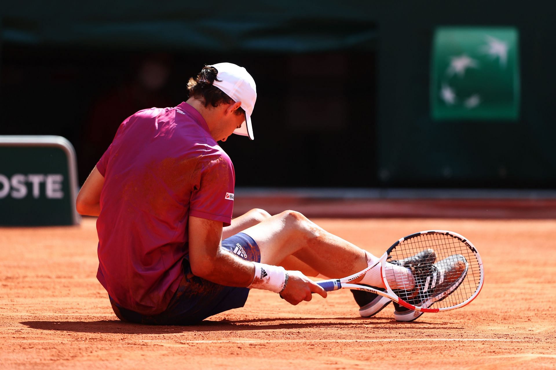 Dominic Thiem after a fall during a match at the 2021 Roland Garros in June