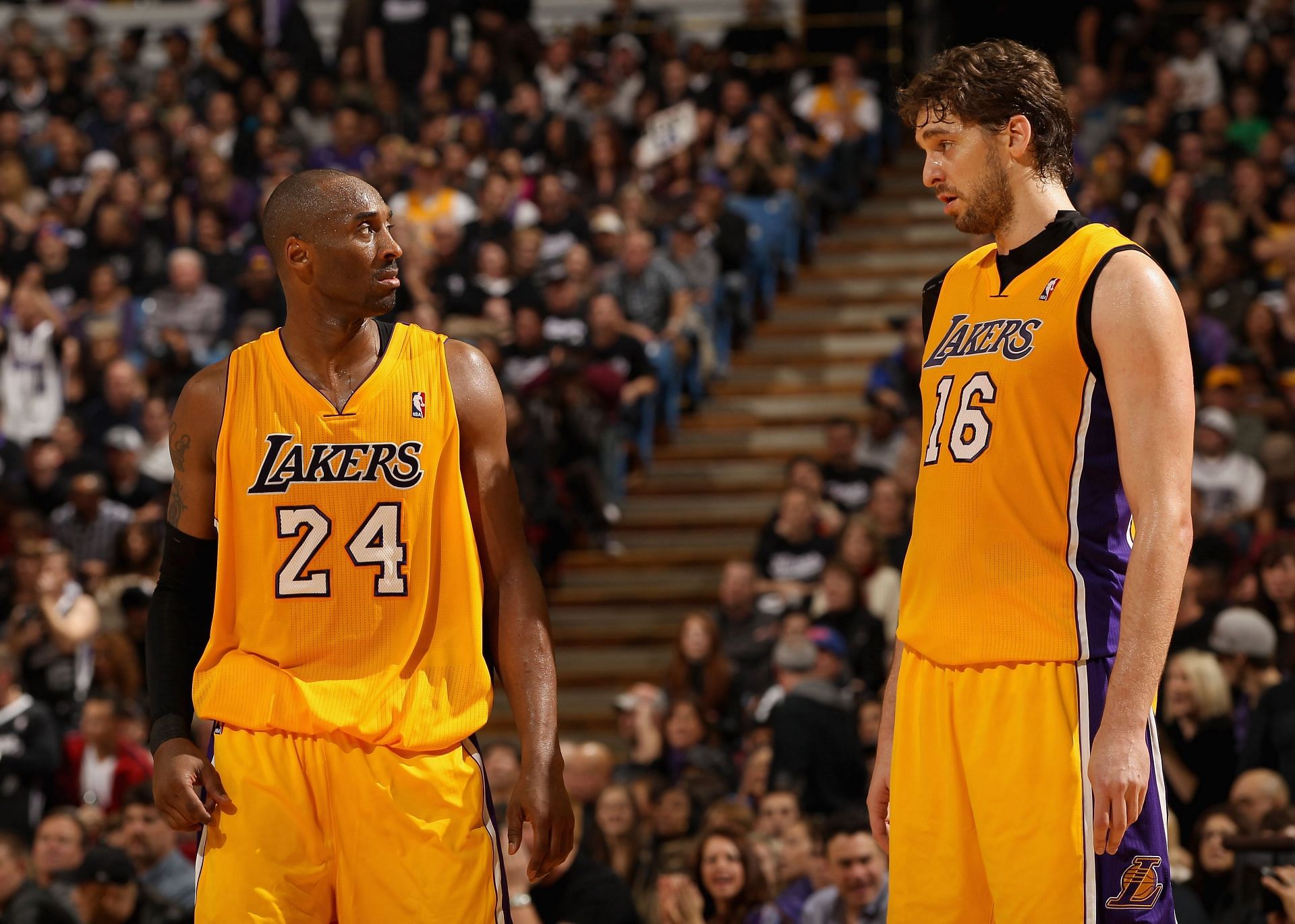 Kobe Bryant #24 talks to Pau Gasol #16 of the Los Angeles Lakers during their game against the Sacramento Kings at Power Balance Pavilion on December 26, 2011 in Sacramento, California.