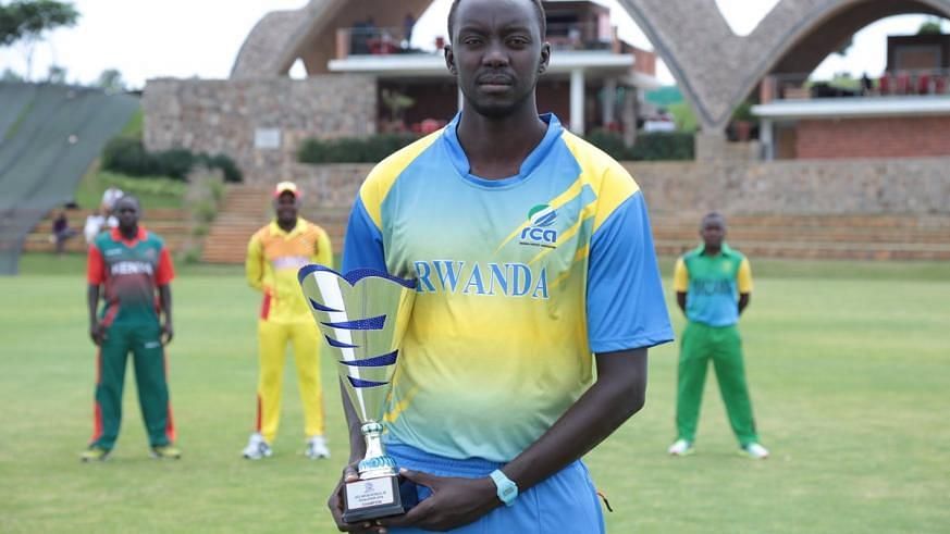 A Rwanda Cricket Team Player posing with a trophy (Image Courtesy: Twitter)