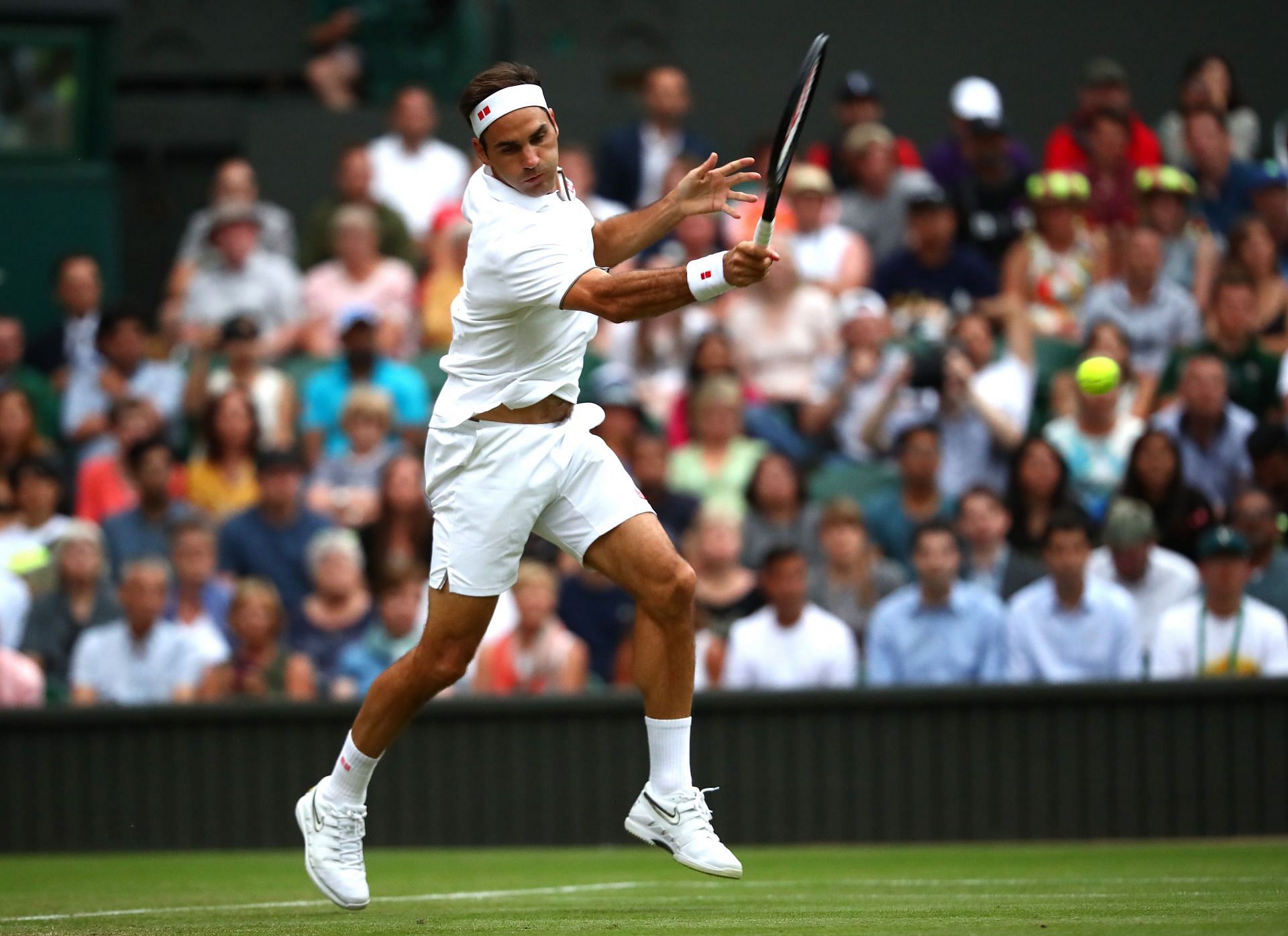 Roger Federer in action against Matteo Berrettini at Wimbledon 2019