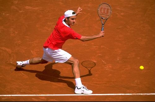 A teenaged Roger Federer in action on tour