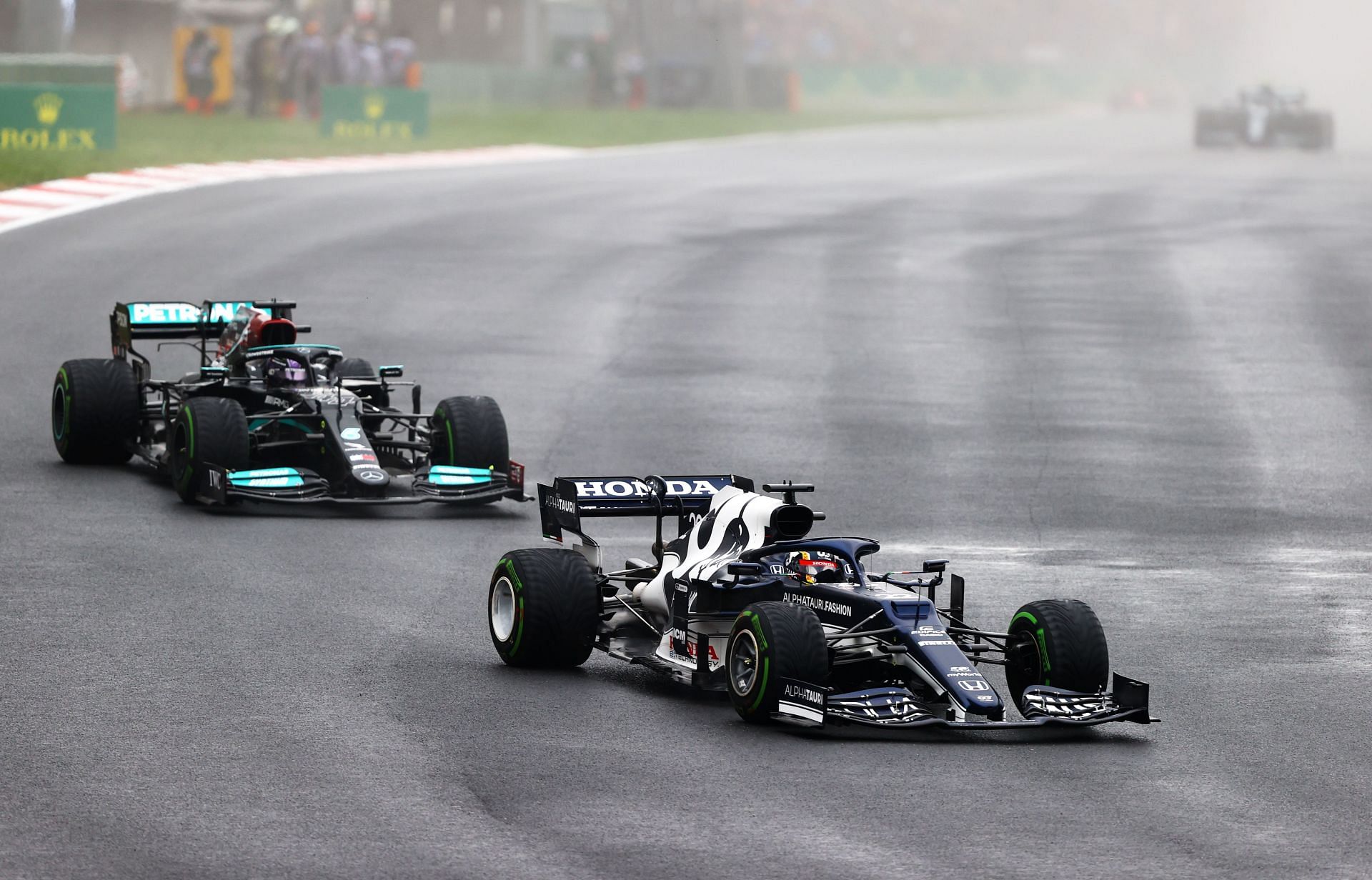 Yuki Tsunoda leads Lewis Hamilton during the 2021 Turkish GP. (Photo by Bryn Lennon/Getty Images)