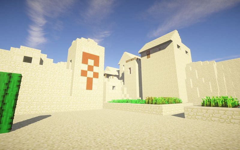 An image of a desert temple and village in-game. (Image via Minecraft)