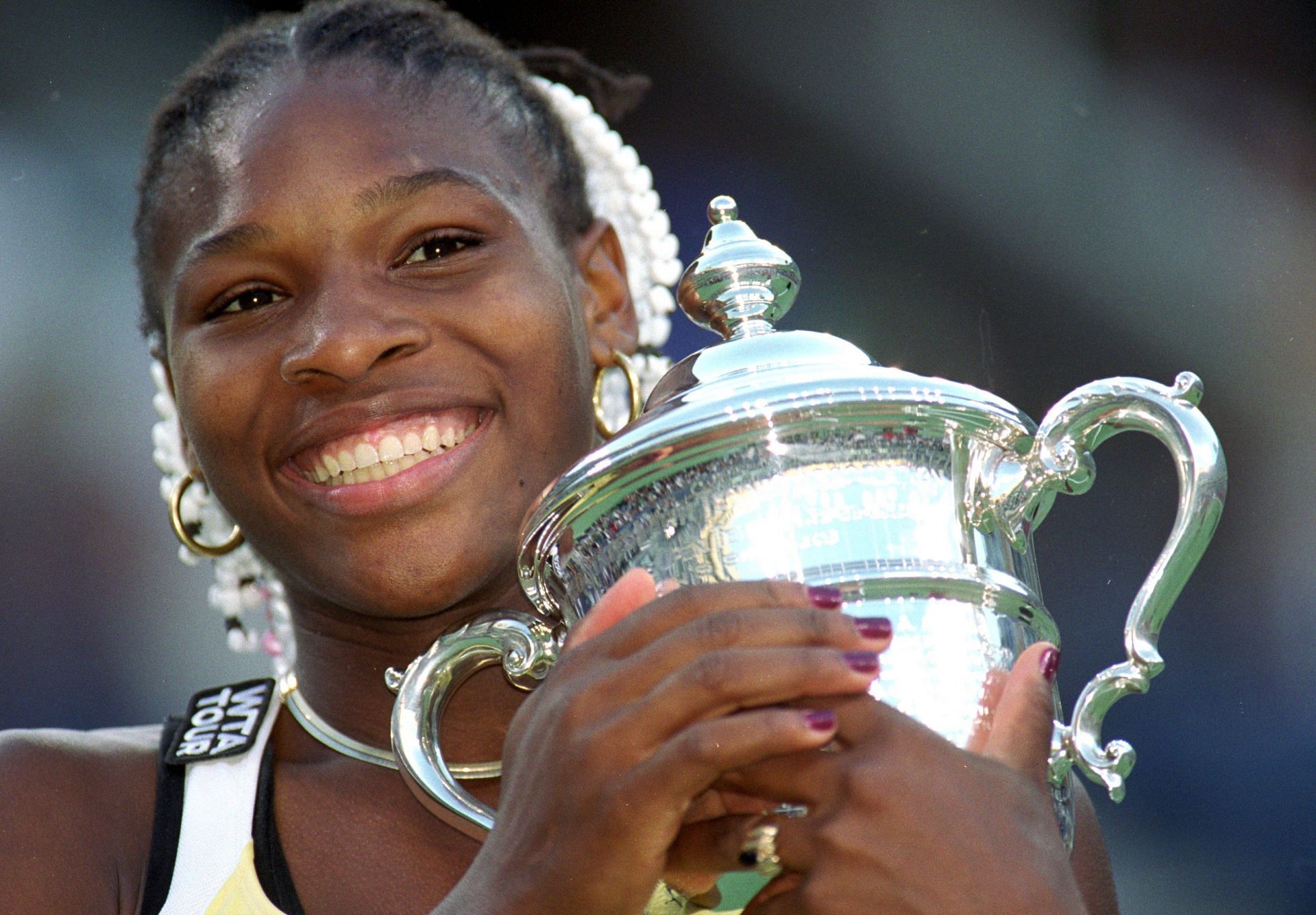 Serena Williams with her 1999 US Open trophy