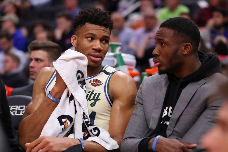 Giannis Antetokounmpo (#34) of the Milwaukee Bucks talks to his brother Thanasis Antetokounmpo (#43).