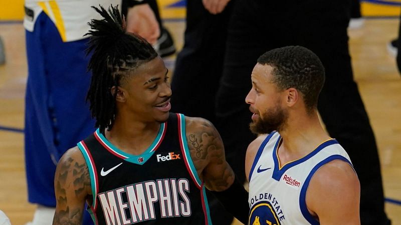 Ja Morant of the Memphis Grizzlies with Stephen Curry of the Golden State Warriors